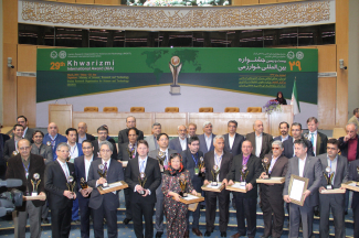 Group photo of Iranian leaders and the Laureates.