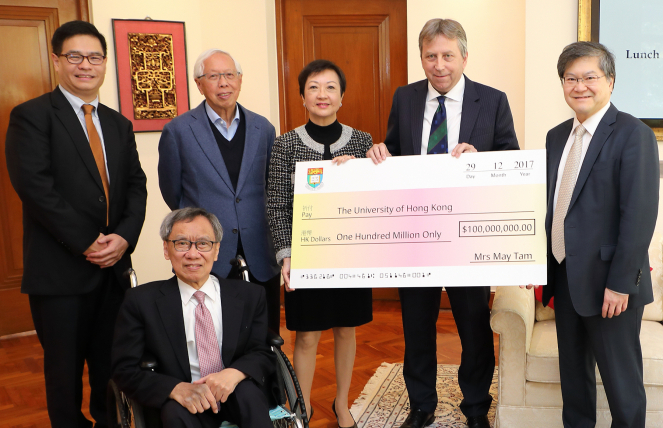 Mrs May Tam (centre) and her team (from left) Mr Heman Hsuan, Professor T. H.  Tse and Mr Edward Ho presented a donation cheque of HK$100 million to the HKU Faculty of Engineering earlier to establish the Tam Wing Fan Innovation Wing.