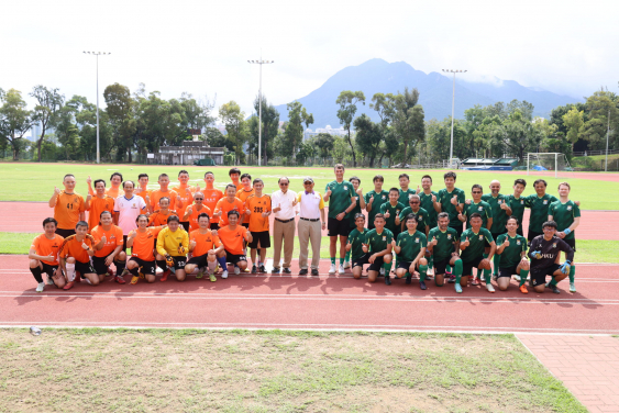 A group photo of the two teams.
