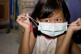 Cases in this studies come from families in Hong Kong and Bangkok. A study participant in Bangkok is donning a surgical mask.